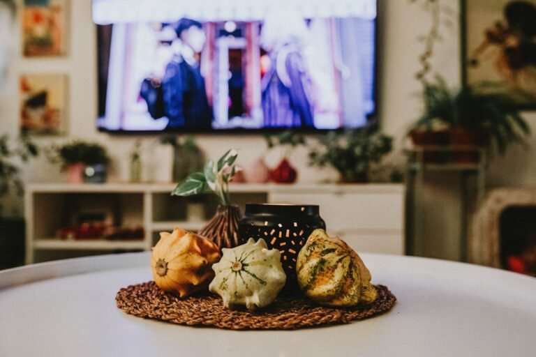 Warm autumn living room with knit blankets amber cushions and candles creating cozy hygge atmosphere
