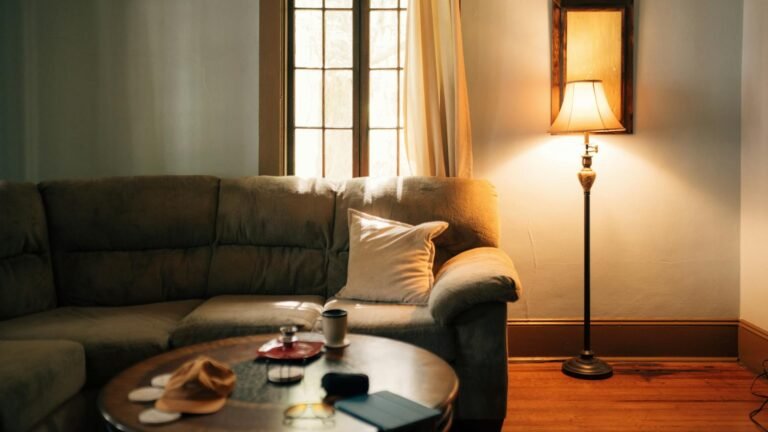 Warm cozy living room with soft textiles, candles, and ambient lighting perfect for Prime Day home refresh