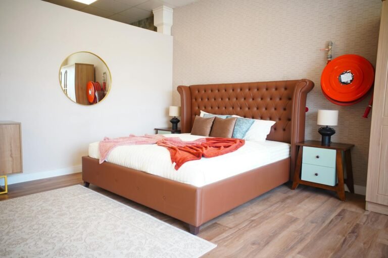 Beautifully organised bedroom with neutral bedding, floating nightstand, and soft ambient lighting creating a calm retreat