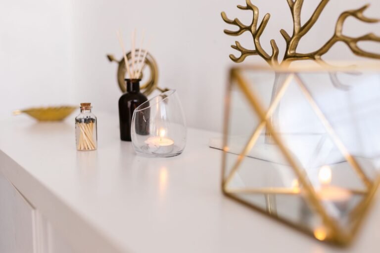 Elegant reed diffuser with rattan sticks on a wooden console table in a bright welcoming living room