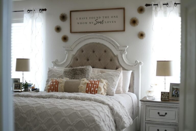 Warm inviting bedroom with layered bedding throws and soft ambient lighting creating a cozy sanctuary