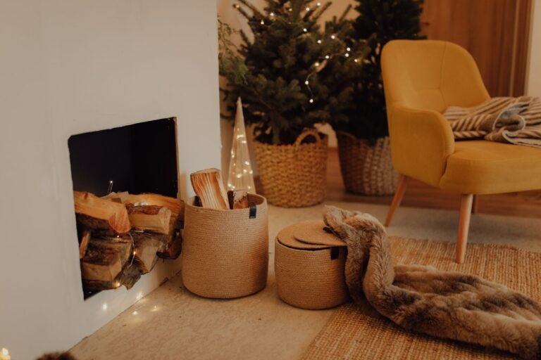 Natural seagrass and wicker baskets arranged beside a cozy sofa with soft blankets and neutral living room decor