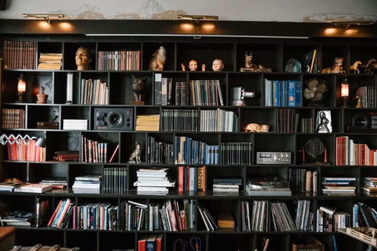Beautifully styled bookshelf with books, plants, and decorative objects in a cozy living room